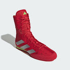 Side profile of Adidas Box Hog boxing boots highlighting reinforced textile upper and sleek fit.