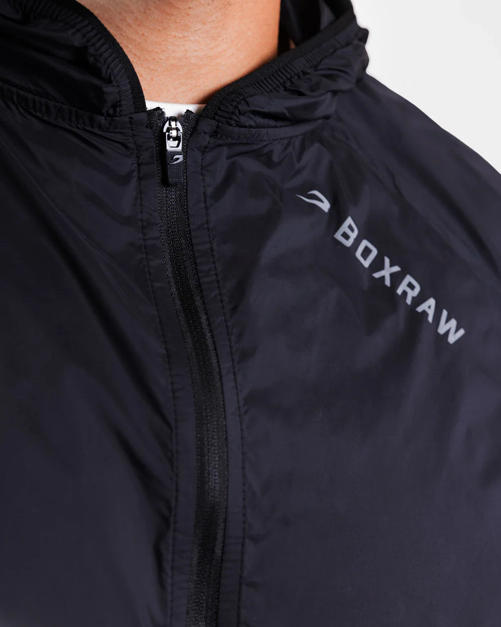 Close-up of reflective shoulder and back logo detail on Boxraw Genaro Windbreaker Black
