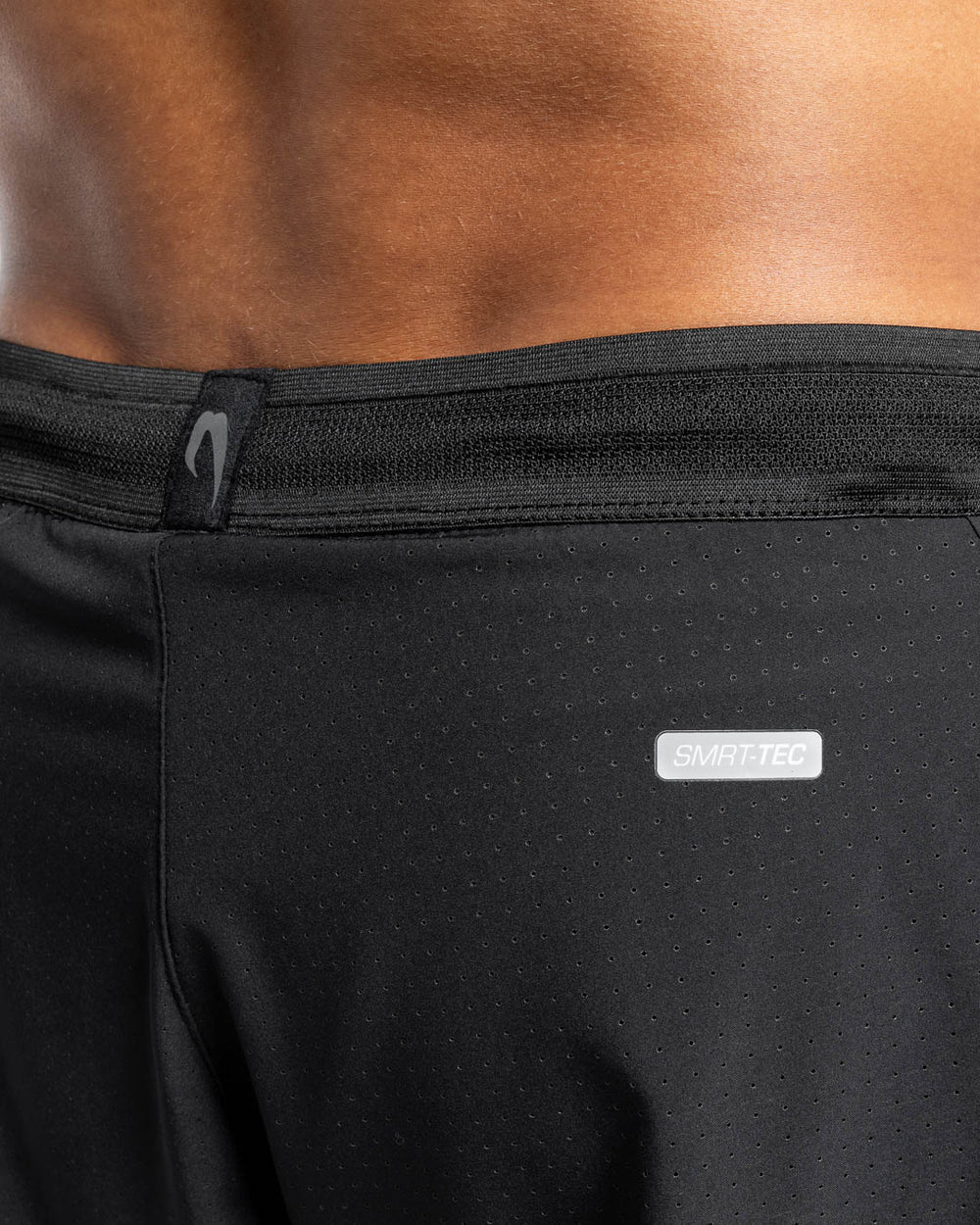 Reflective SMRTTEC logo and laser perforated ventilation detail on Boxraw Tunero Shorts Black