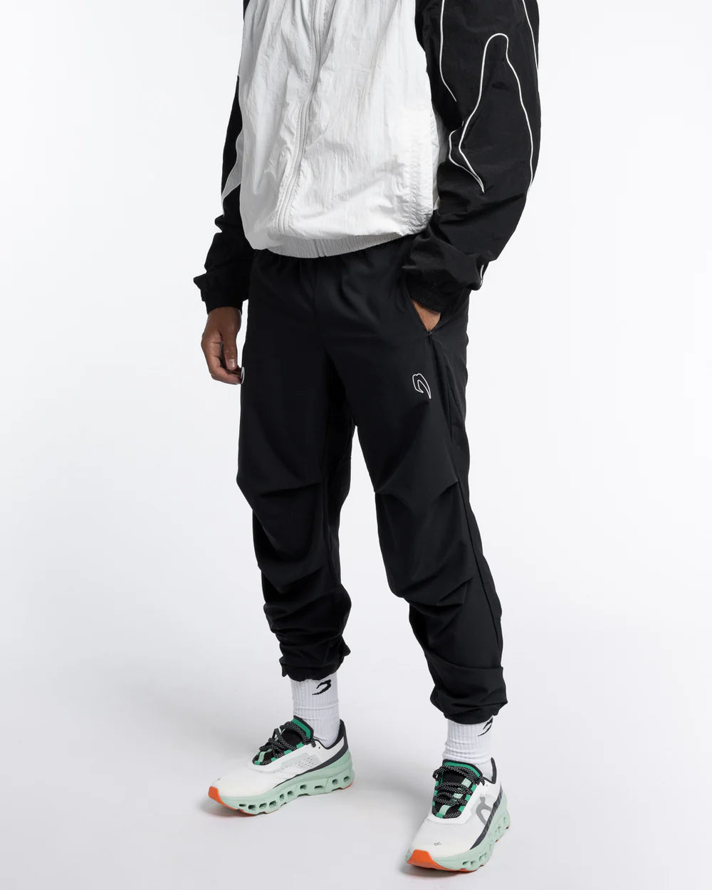Side view of Boxraw Tunero Track Bottoms Black showing Double Strike design