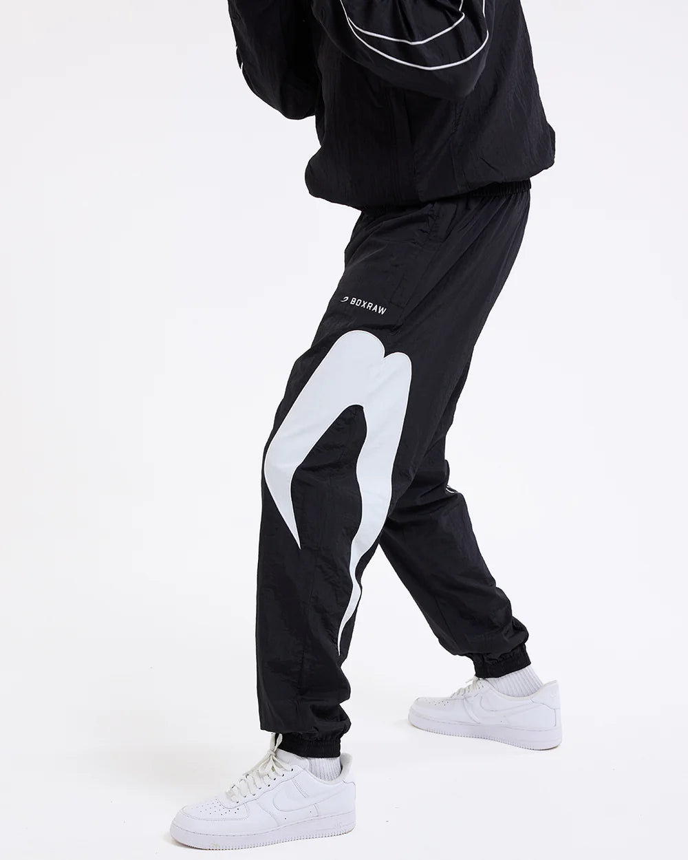 Boxraw Tunero Track Bottoms Black front view showing relaxed fit and lightweight training design