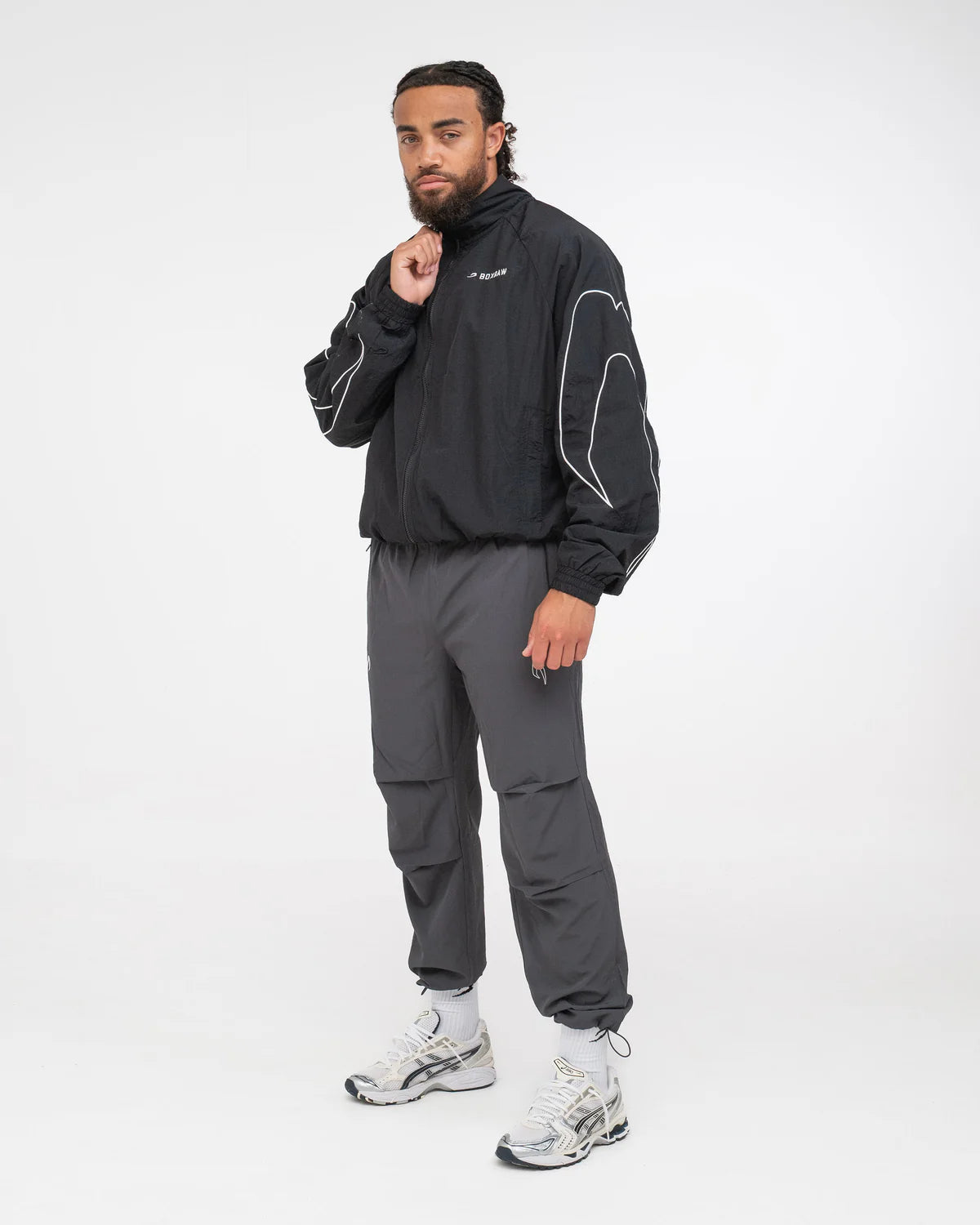 Side view of Boxraw Tunero Track Bottoms Charcoal showing Double Strike design and relaxed fit