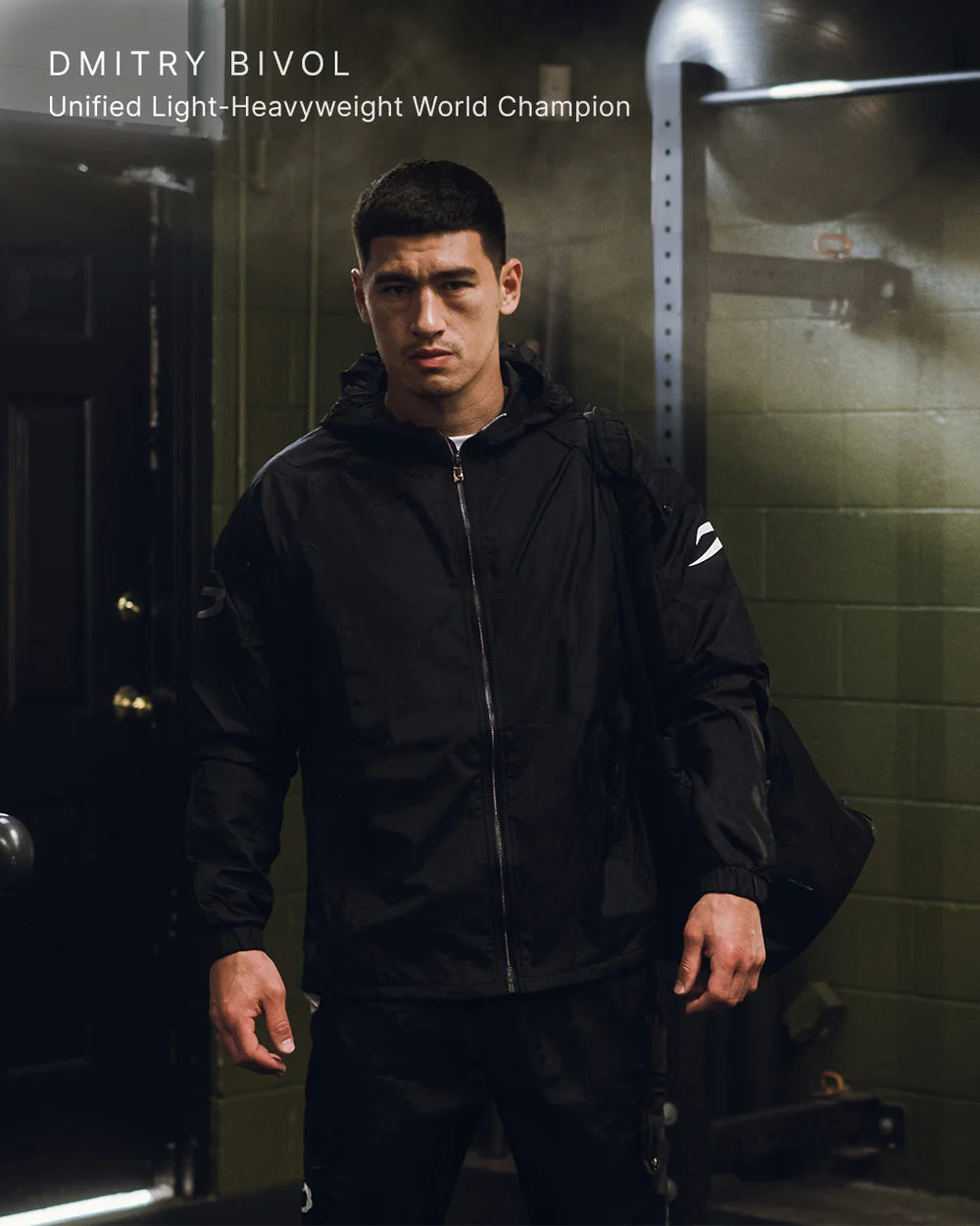 Dmitry Bivol wearing the Boxraw Dundee Windbreaker Jacket Charcoal as boxing lifestyle apparel