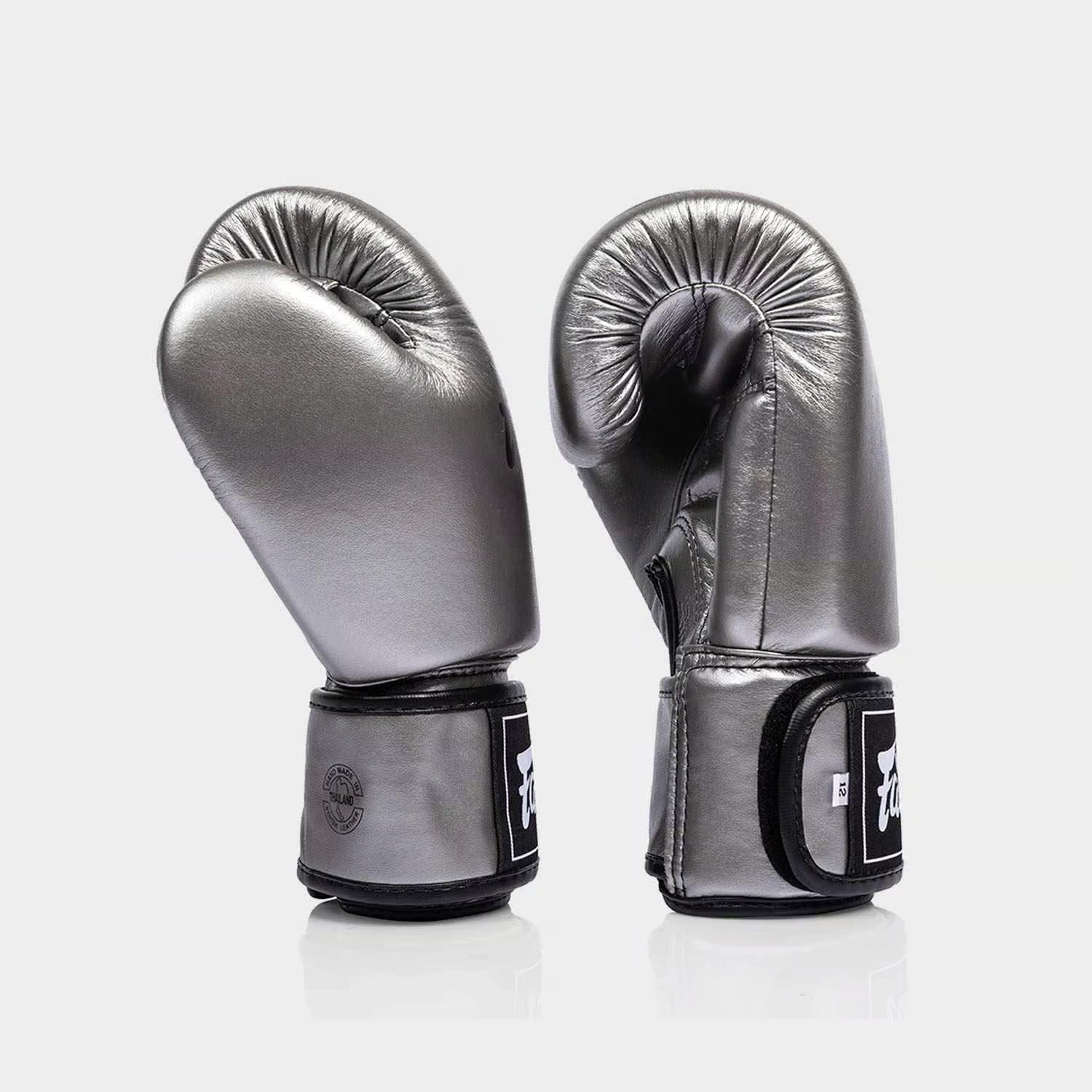 Fairtex BGV1C-PLUS microfibre gloves used during Muay Thai training in a boxing gym