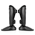 Professional Fairtex MMA and kickboxing shin protectors with extended side and toe coverage.