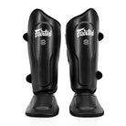 Fairtex shin guards for Muay Thai, MMA, and kickboxing with ergonomic open system design.