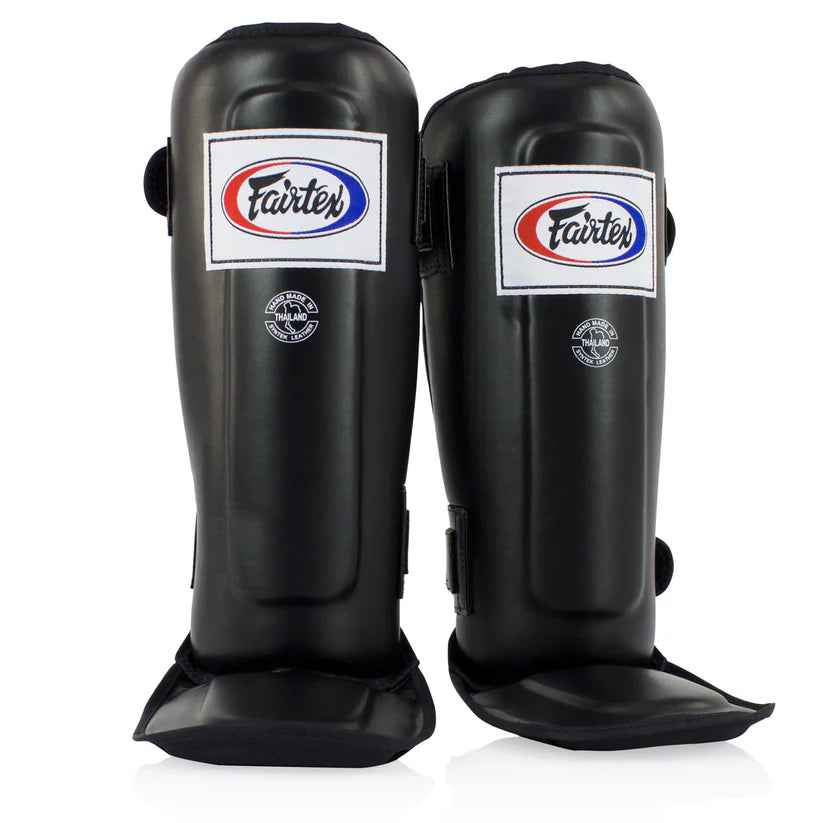 Handmade in Thailand Fairtex shin pads with durable Syntek leather and ergonomic design.