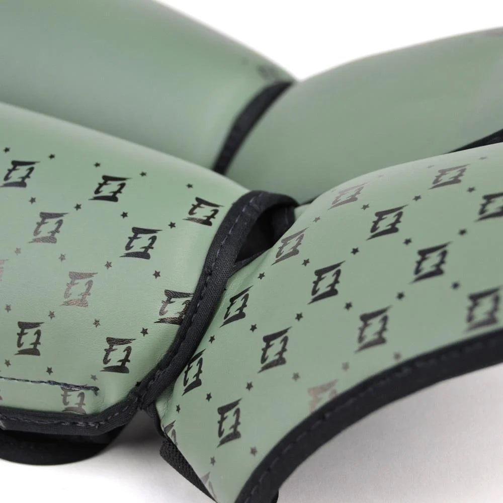 Angled view of Fairtex SP5 Olive Green Muay Thai shin guards showing the contoured shin and instep design