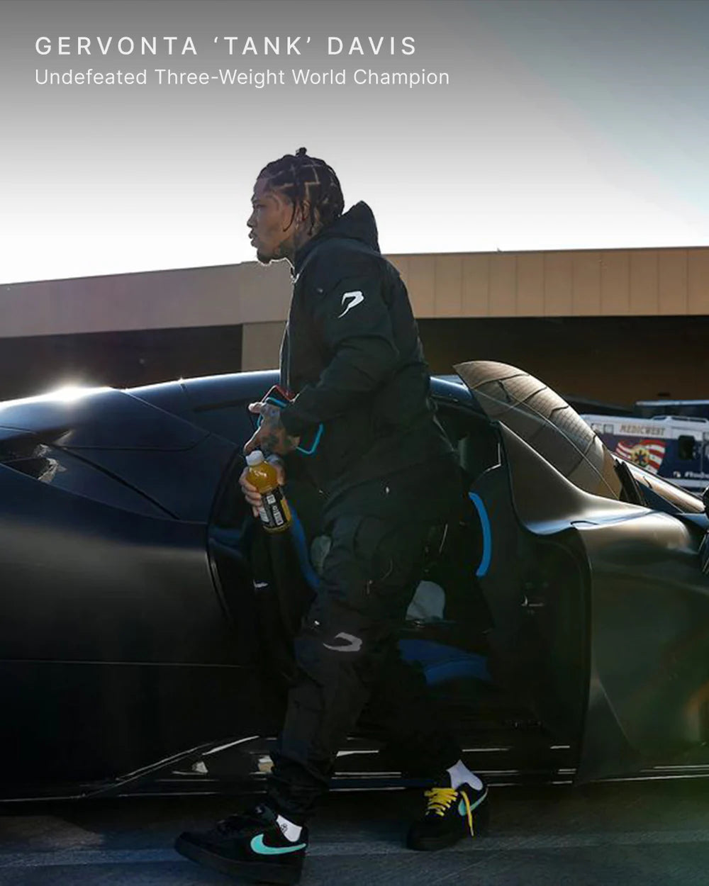 Gervonta Tank Davis wearing the Boxraw Dundee Windbreaker Jacket Charcoal in a lifestyle setting