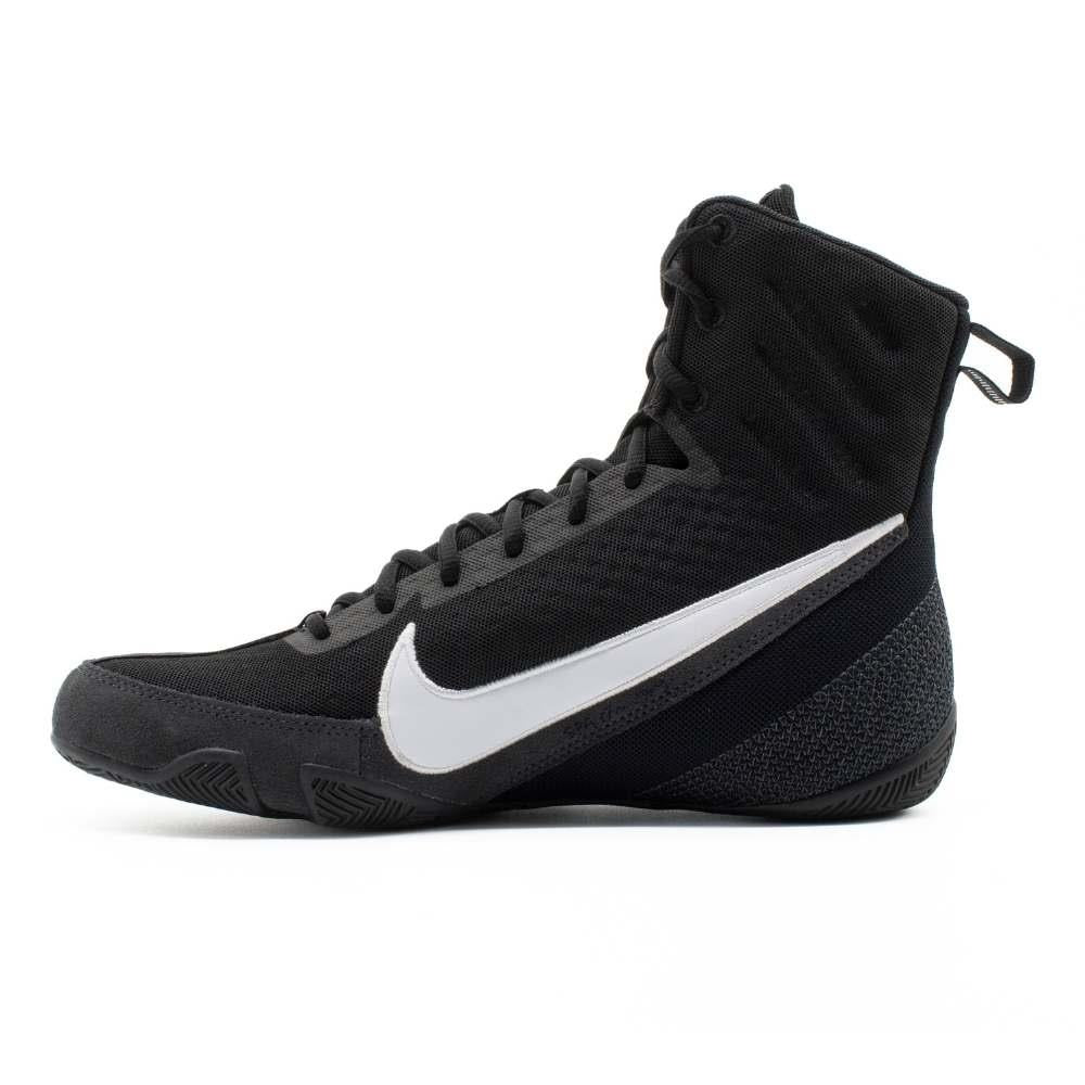 Side view of Nike Machomai 3 boxing shoes in black and white showing athletic silhouette and durable design.