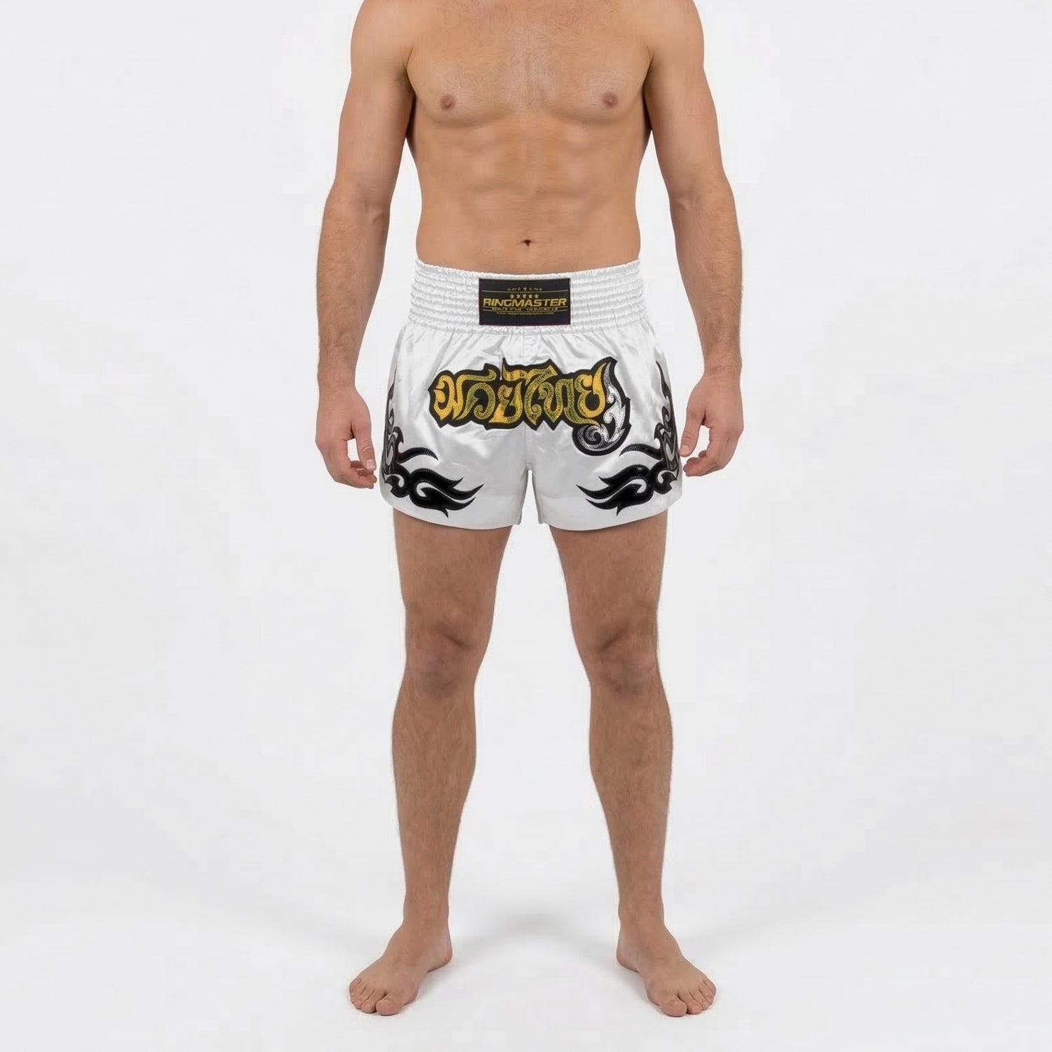 Side view of pearl white Muay Thai shorts with tribal flame design and high side slit