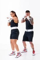 Unisex Sting Mettle Black boxing shorts for men and women, built for comfort and professional performance.