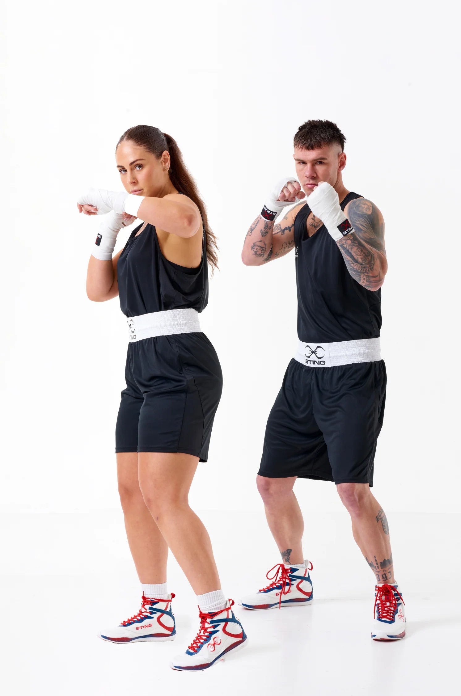 Unisex Sting Mettle Black boxing shorts for men and women, built for comfort and professional performance.