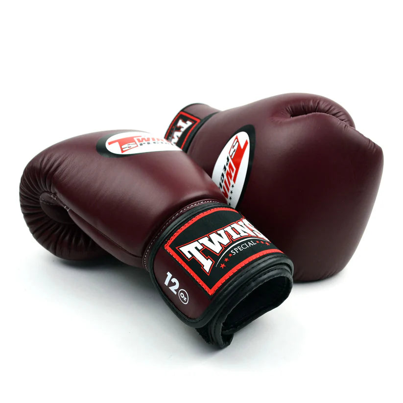 Twins BGVL4 Thai leather sparring gloves with streamlined padding and secure Velcro strap.
