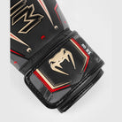 Professional Venum Elite Evo boxing gloves offering superior hand and knuckle protection with ergonomic design.