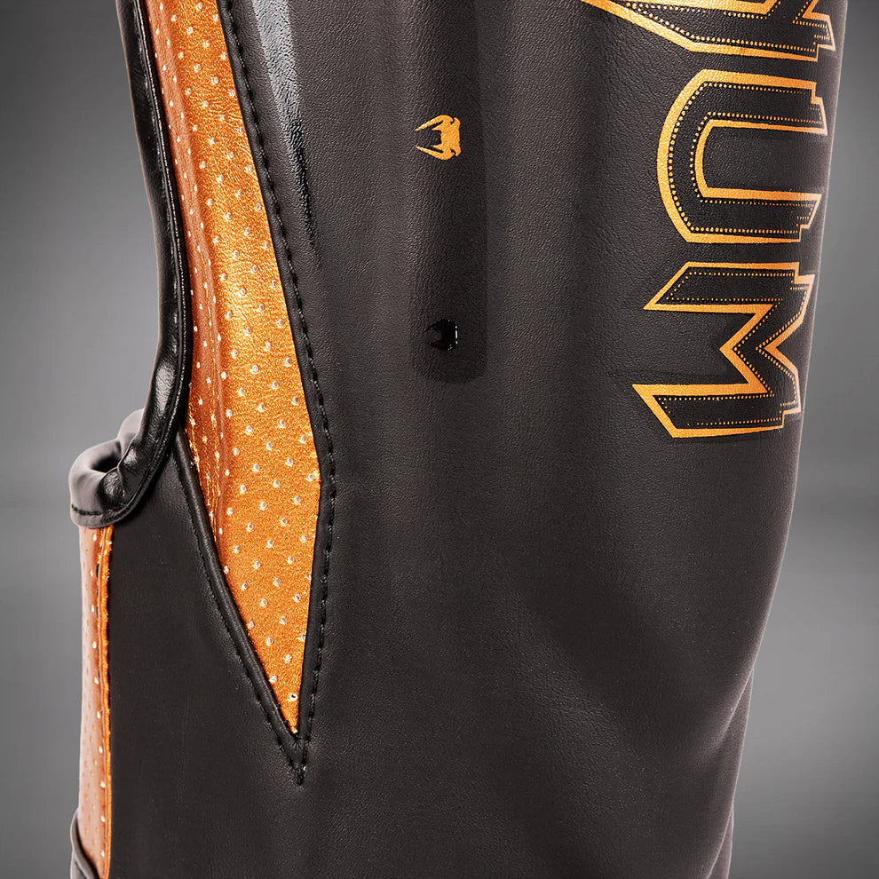 Ultra-durable Japanese microfiber Venum Elite Evo shin guards handcrafted in Thailand.