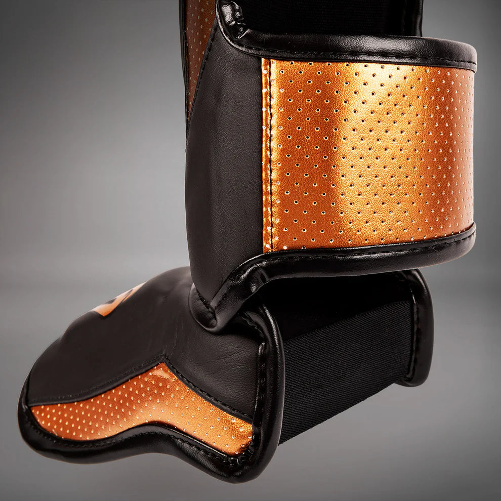 Lightweight and ergonomic Venum Elite Evo shin guards for professional fighters.