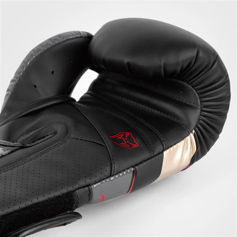 Shock-absorbing Venum Elite Evo sparring gloves with quadruple foam padding.
