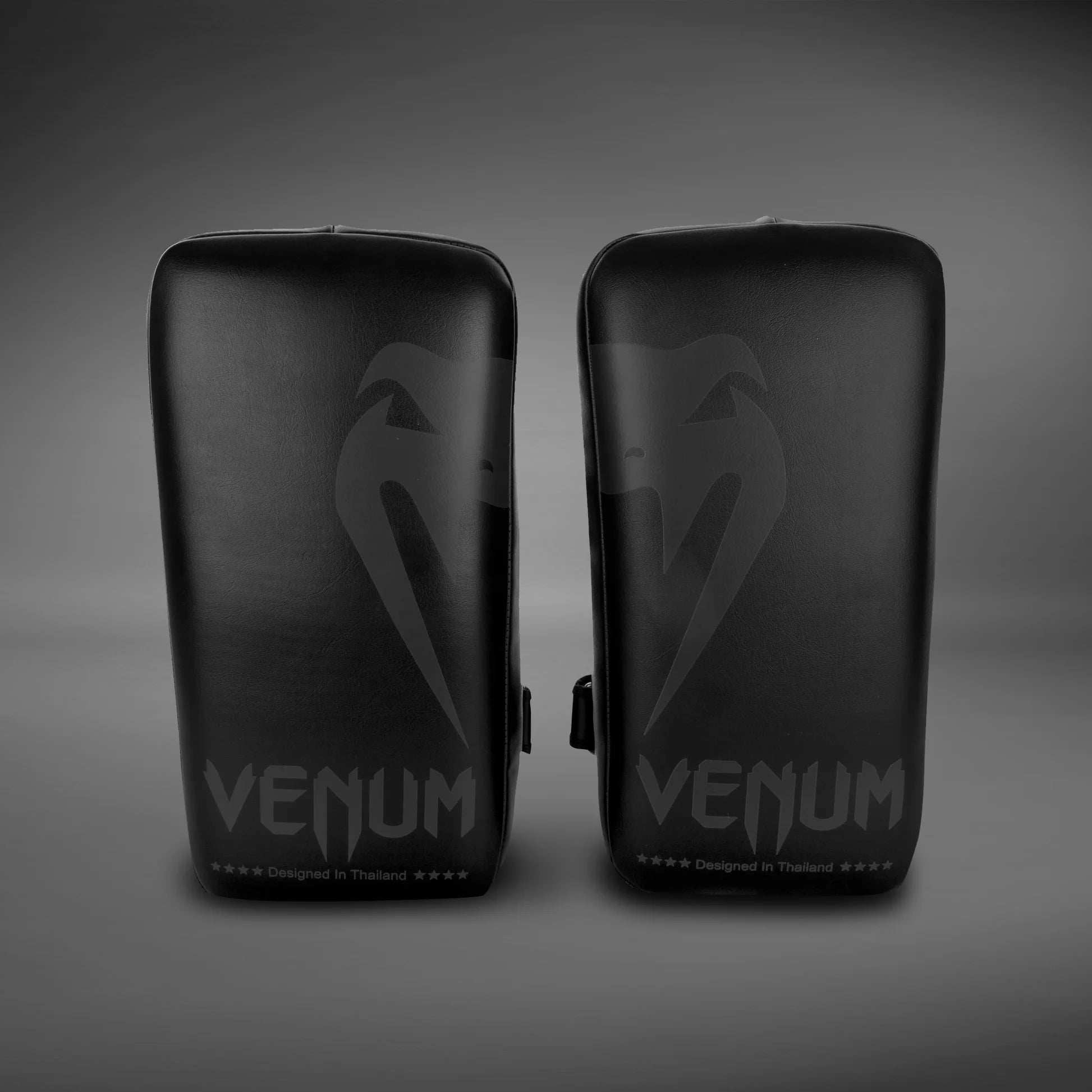Venum Giant Kick Pads for Muay Thai, MMA, boxing, and kickboxing training with dense foam padding.