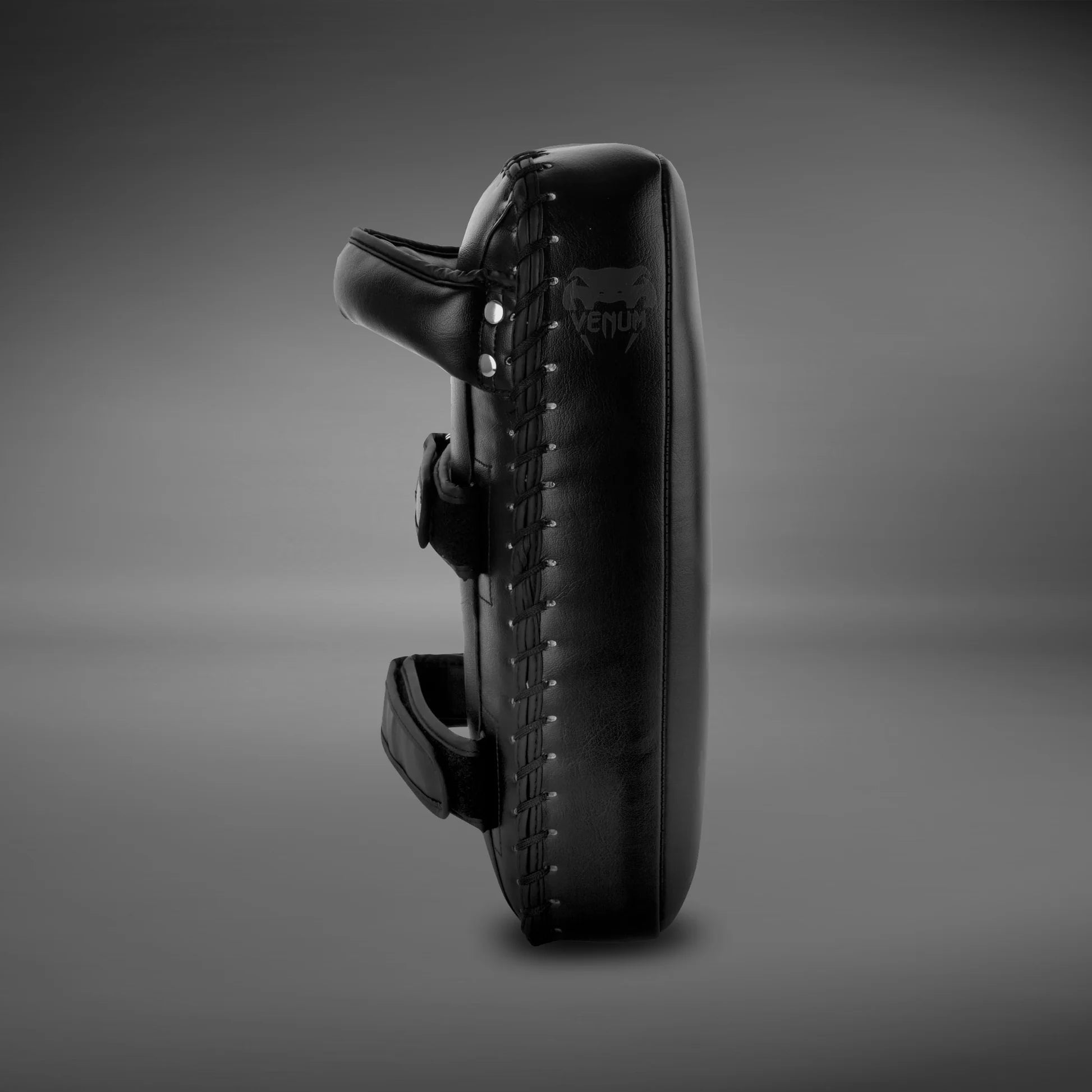 Professional Venum Giant strike pads with padded straps and forearm support for trainer comfort.