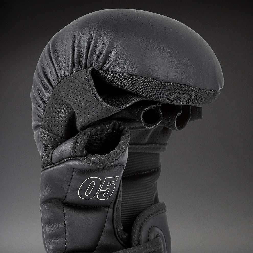 Skintex leather surface and beige stitching detail on Venum Impact Evo MMA Sparring Gloves Black
