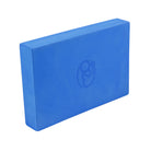 Yogi using Yoga-Mad Full Yoga Block blue for balance and alignment during seated yoga pose.
