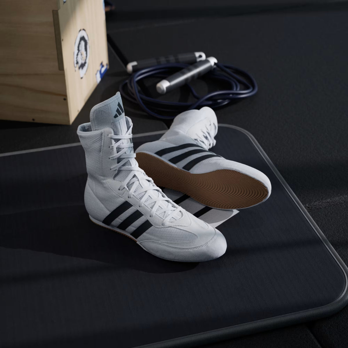 Rear three-quarter view of adidas Box Hog 2 boxing shoes in White showing the heel and ankle profile