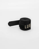 Boxraw 4.5m Sparring Club Hand Wraps Black Gold shown with washable carry pouch