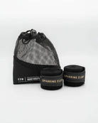 Patent-pending hook and loop thumb loop close-up on Boxraw 4.5m Sparring Club Hand Wraps Black Gold
