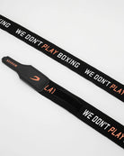 Rolled Boxraw 4.5m Sparring Club Hand Wraps Black Orange showing compact wrap design