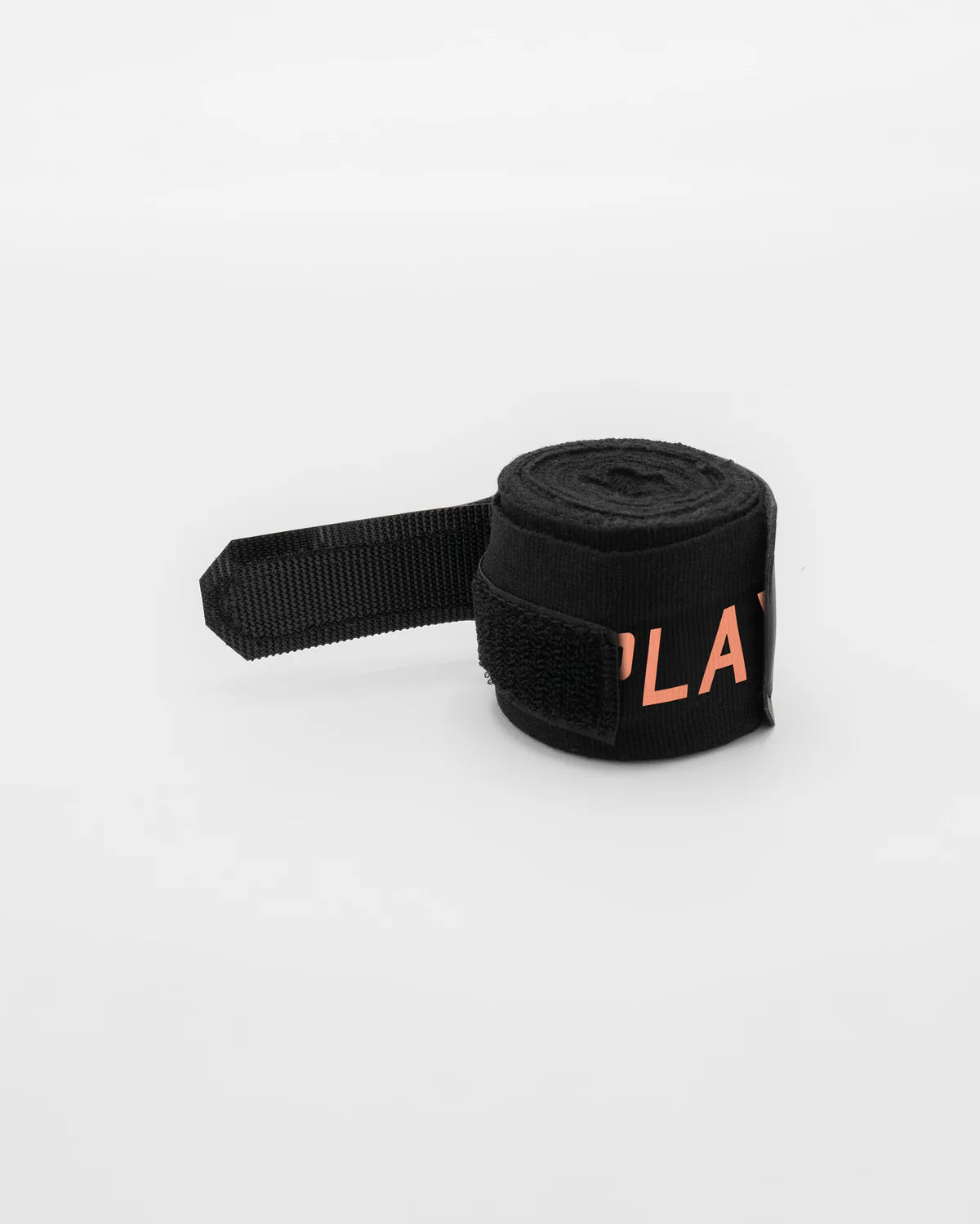 Patent-pending hook and loop thumb loop close-up on Boxraw 4.5m Sparring Club Hand Wraps Black Orange