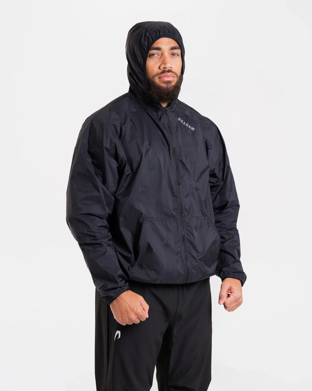 Close-up of reflective shoulder and back logo detail on Boxraw Genaro Windbreaker Black with hood