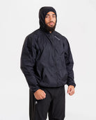Close-up of reflective shoulder and back logo detail on Boxraw Genaro Windbreaker Black with hood