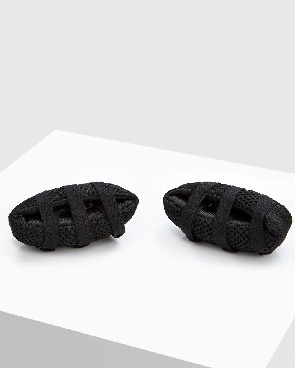 BOXRAW Knuckle Guards attached to boxing hand wraps during wrapping process