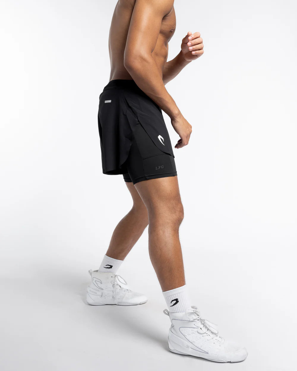 Side view of Boxraw Tunero 2-in-1 Shorts Black showing Double Strike design and split hem