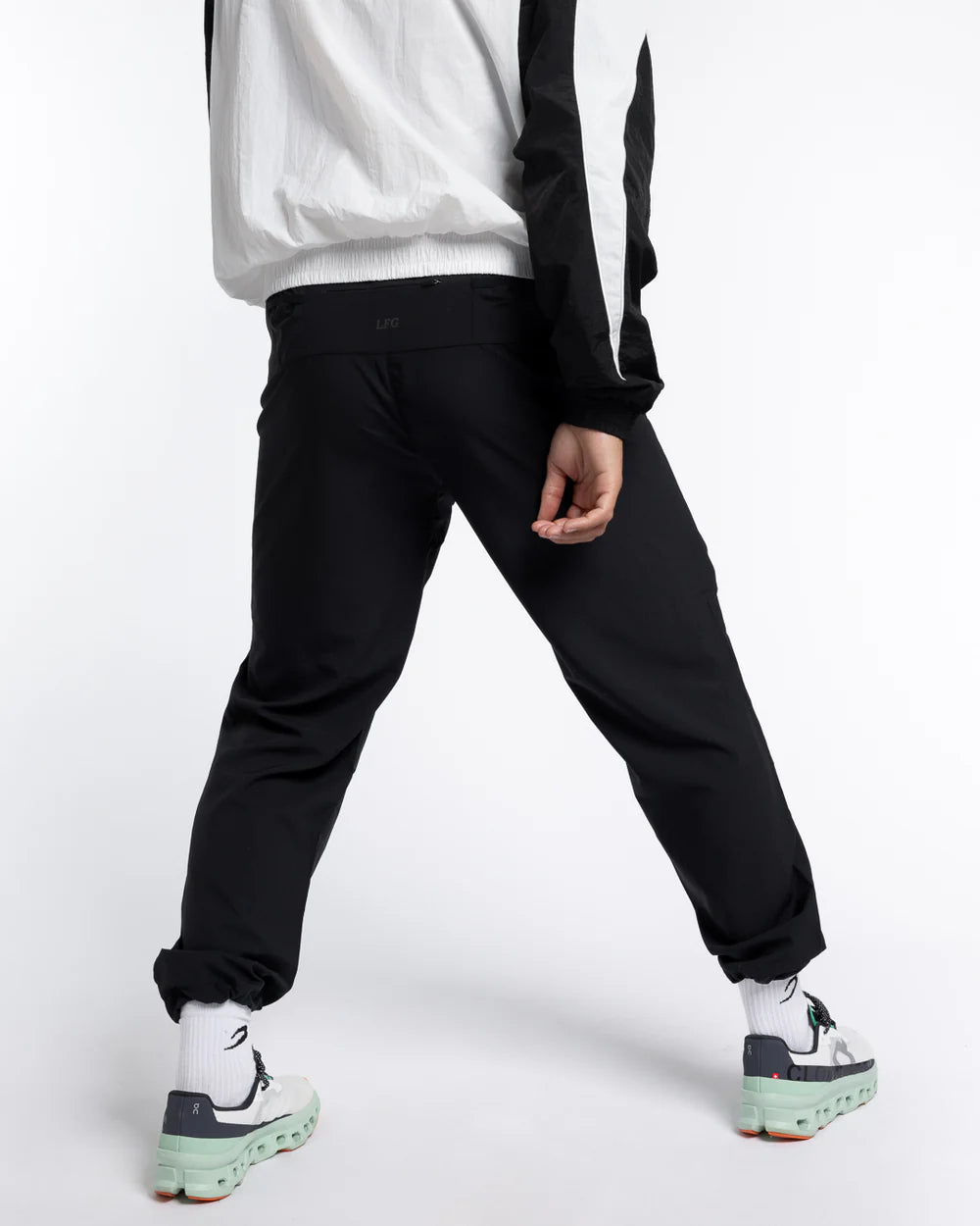 Back view of Boxraw Tunero Track Bottoms Black with laser perforated ventilation panel