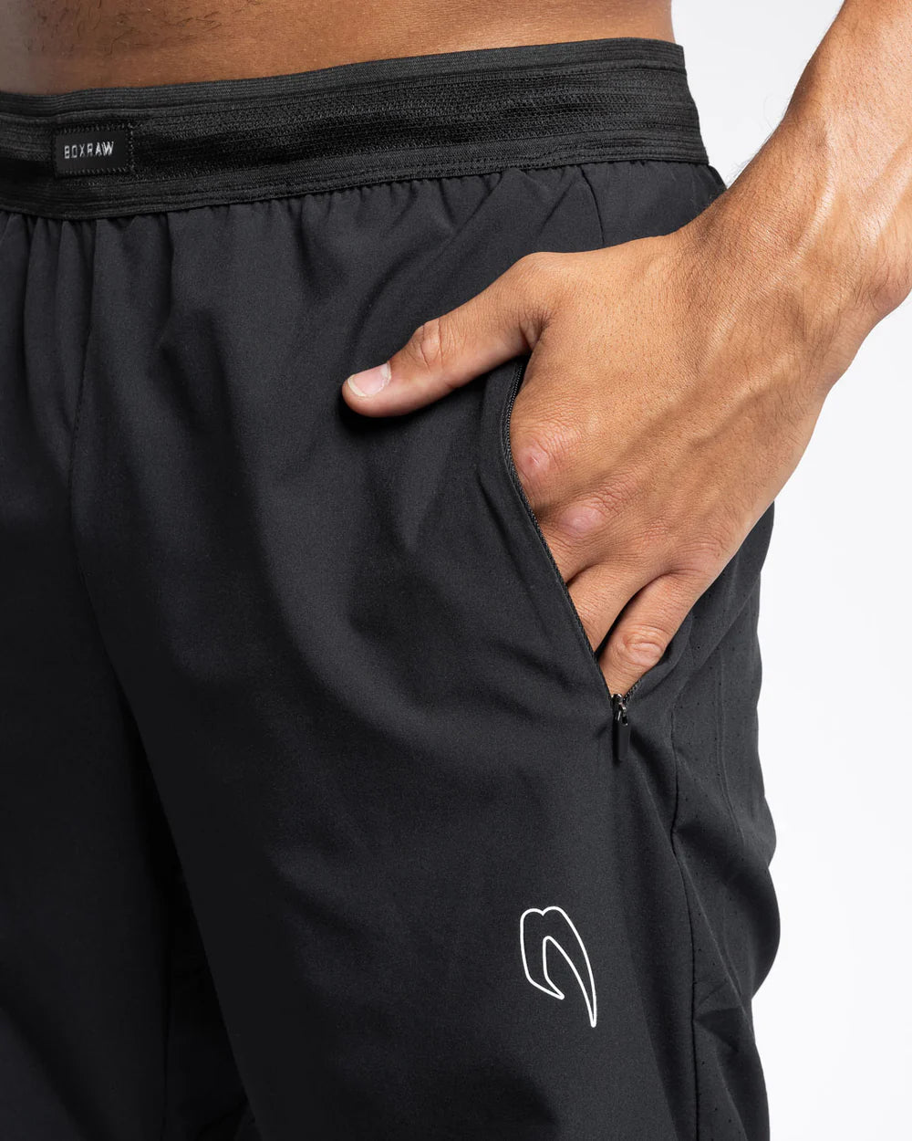 Zipped side pocket and zipped back pouch detail on Boxraw Tunero Track Bottoms Black