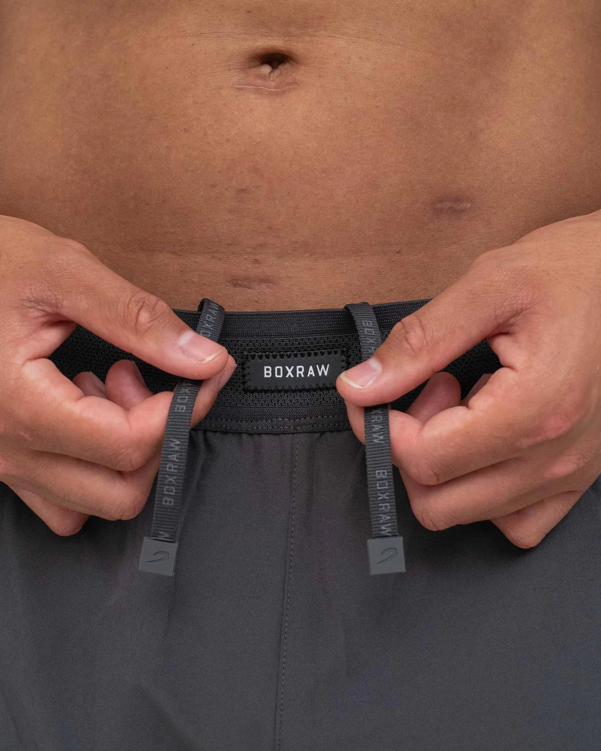Adjustable ventilated waistband close-up on Boxraw Tunero Track Bottoms Charcoal