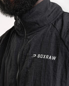 Embroidered logo close-up on Boxraw Tunero Track Jacket