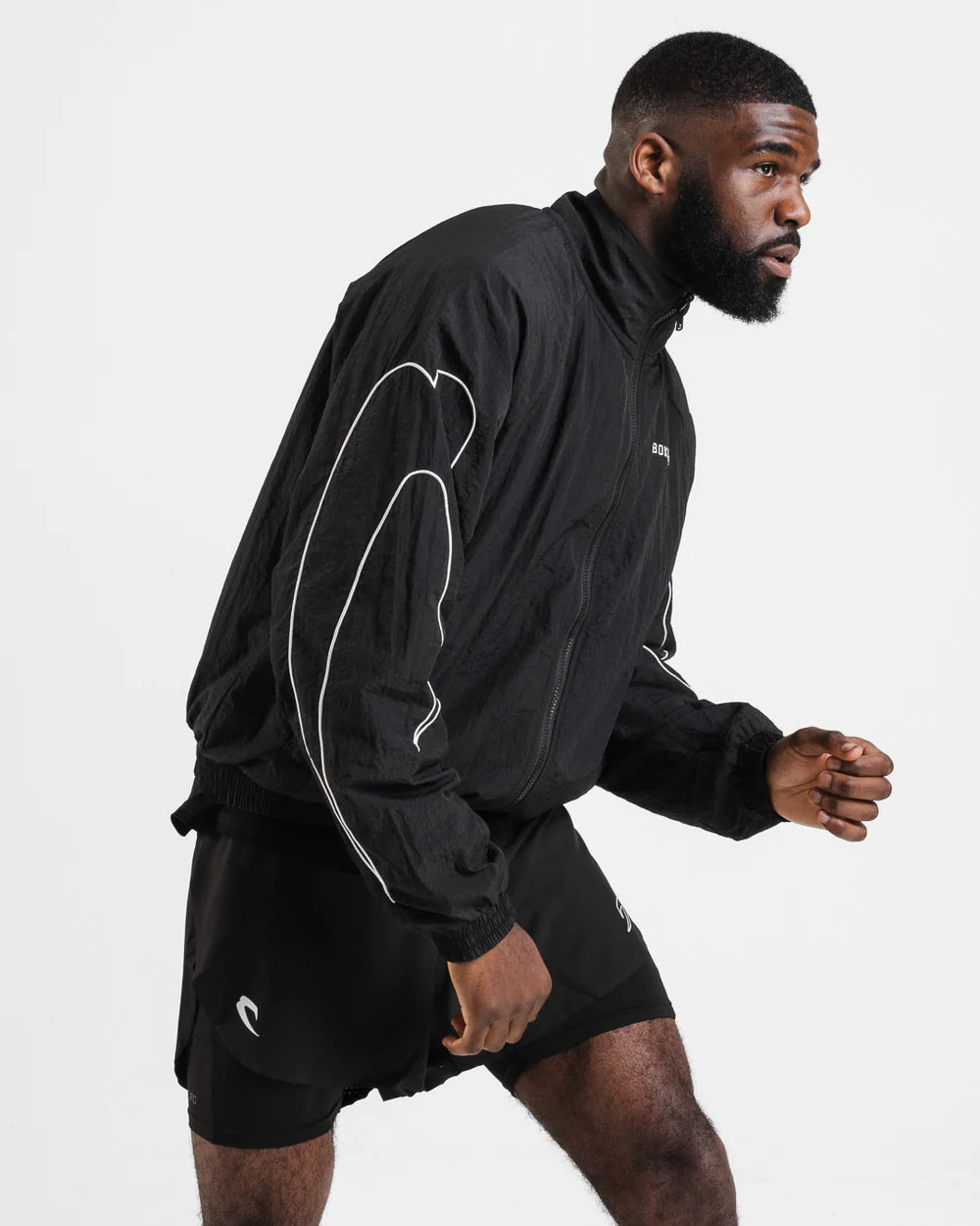 Side view of Boxraw Tunero Track Jacket showing oversized fit and Double Strike sleeve design