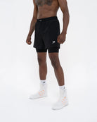 Side view of Boxraw Valdes 2-in-1 Shorts Black showing outer shorts and compression leggings