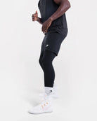 Side view of Boxraw Valdes Full Length Shorts Black showing 2-in-1 compression legging design