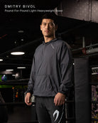 Dmitry Bivol wearing the Boxraw Genaro Oversized Windbreaker Hoodie Black in a lifestyle setting