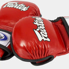 double wrist strap detail on red Fairtex MMA gloves