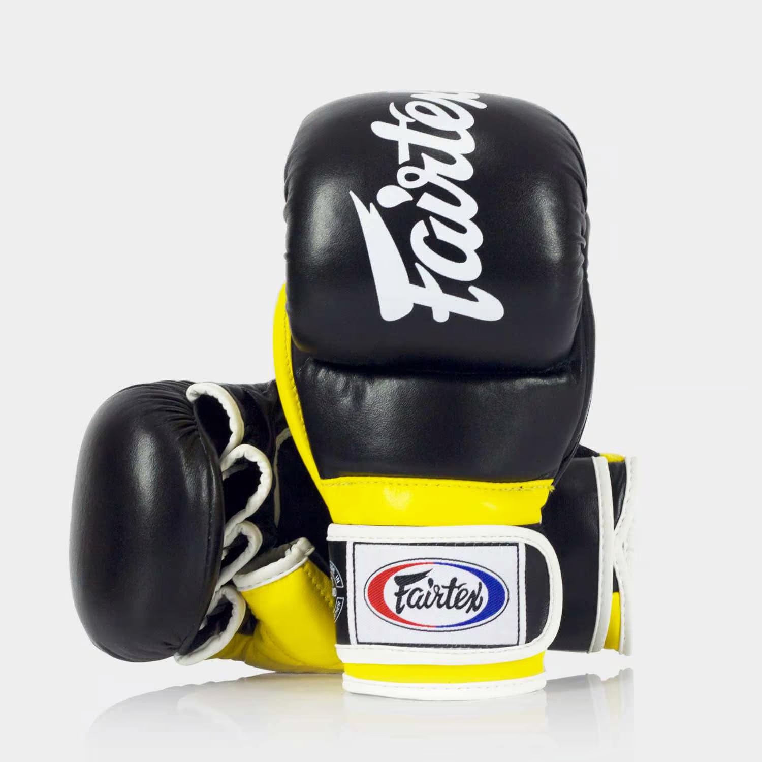Wrap-around wrist strap and thumb padding close-up on Fairtex FGV18 MMA Gloves Black Yellow