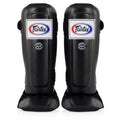 Fairtex shin guards for Muay Thai, MMA, and kickboxing with triple-layer foam protection.