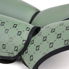 Angled view of Fairtex SP5 Olive Green Muay Thai shin guards showing the contoured shin and instep design