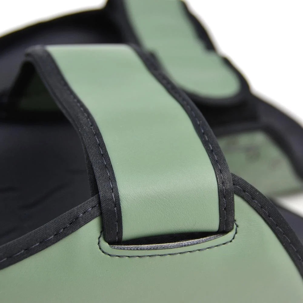 Pair of Fairtex SP5 Muay Thai shin guards in Olive Green displayed together for combat sports training