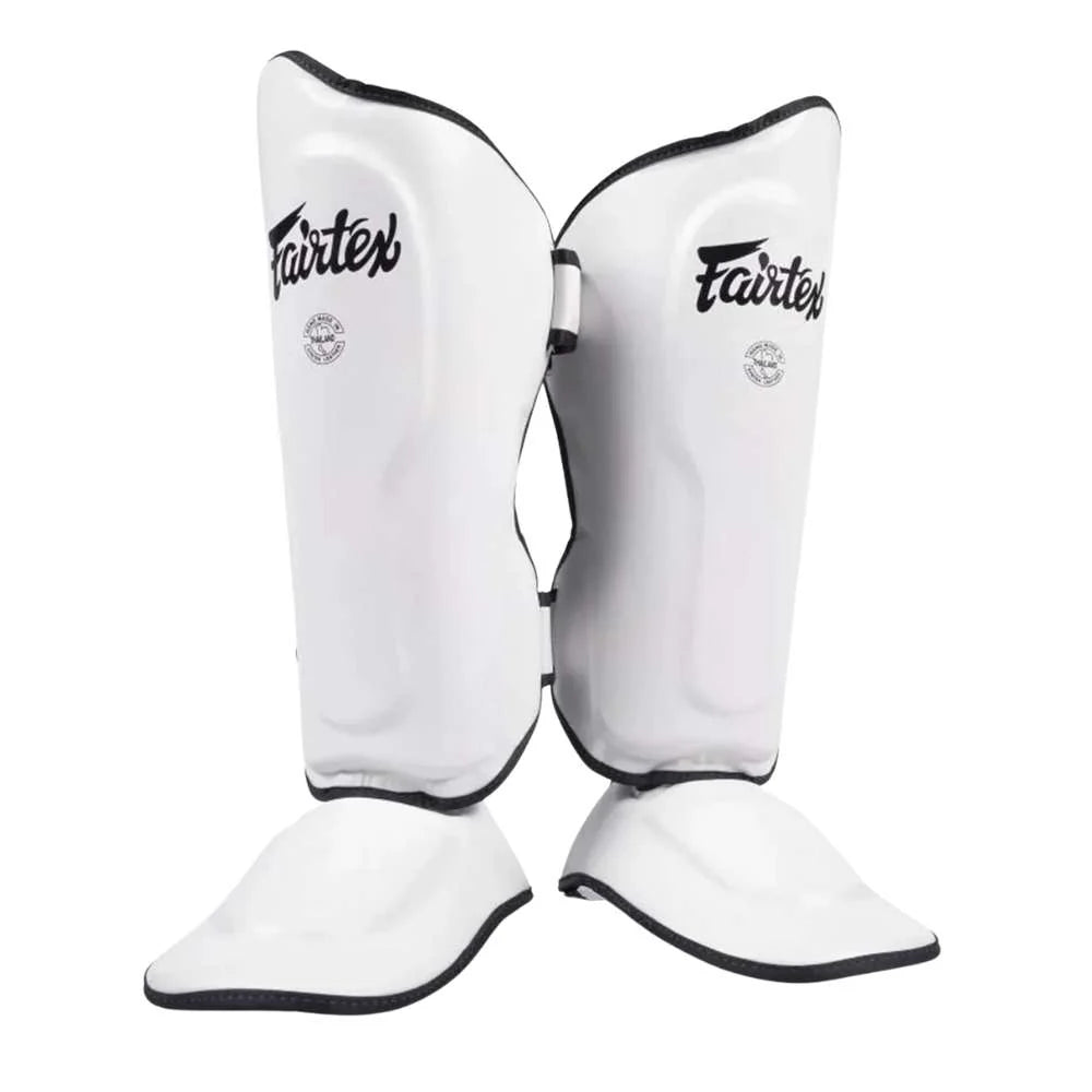 Fairtex Ultra Ergo Shin Guards in White shown from the front with contoured shin and extended toe sections visible