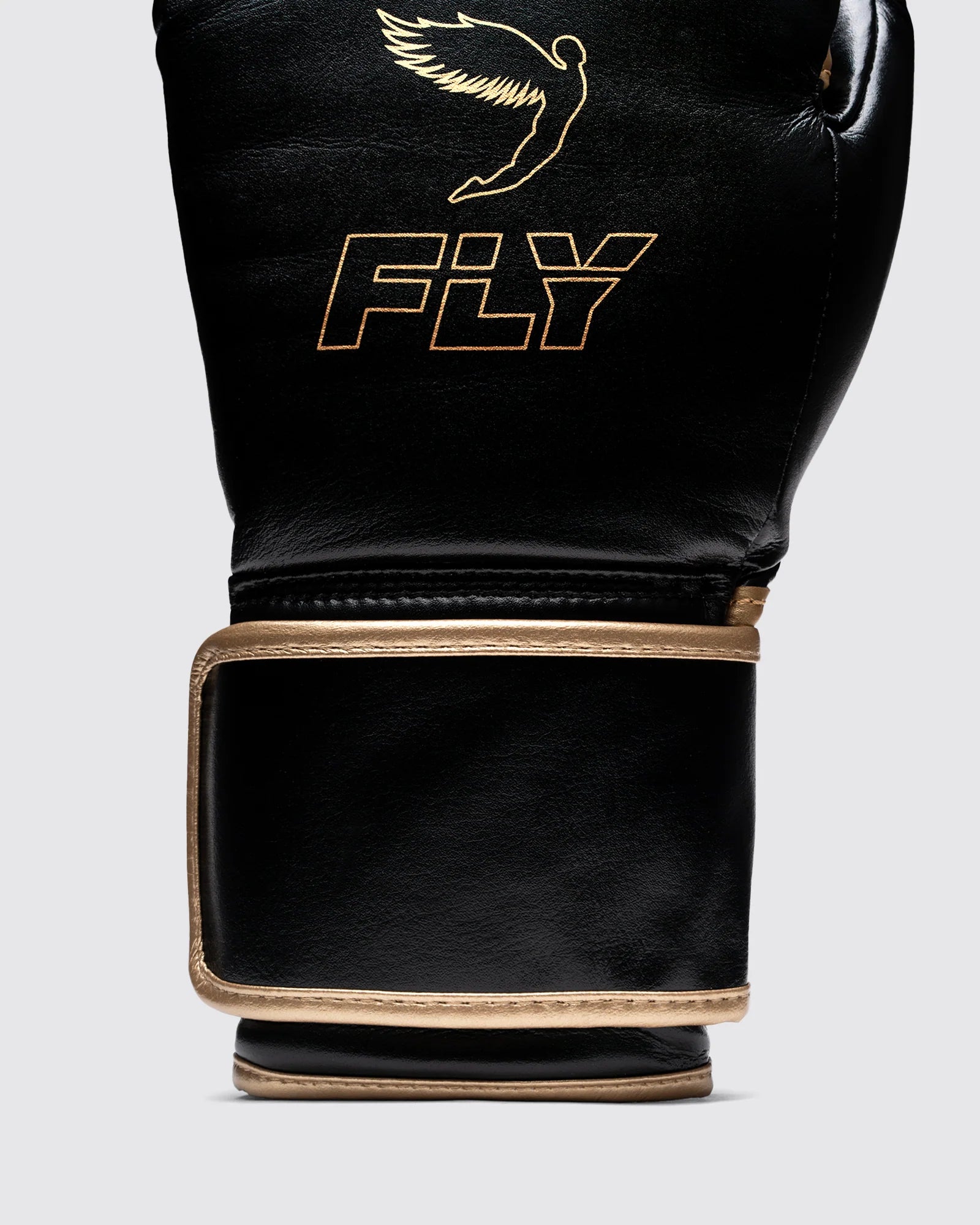 Signature Fly Icarus gold logo embossed on black vegan leather boxing gloves